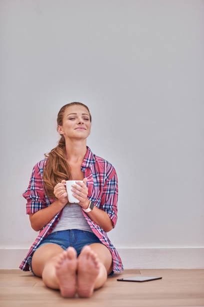 istock Young woman with digital tablet at home 1135823589