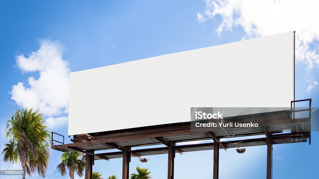 Empty white Billboard for presentation your design, Retail, advertising and commerce concept. Urban outdoor mockup. Perfect for the presentation of your creativity. These mockups are good to use for outdoor advertising! Only one easy step needed to use this mockups: just add or overlay your design and use anywhere. Billboard Stock Photo