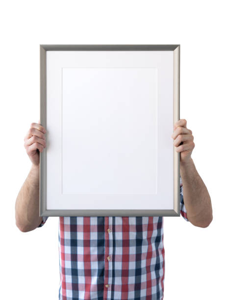 istock Holding frame mockup. Photo Mockup. The man hold frame. For frames and posters design. Frame size 12x16 (30x40cm). 1135826797