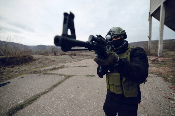 istock Air soft training outdoor man in uniform holding the gun 1135826855