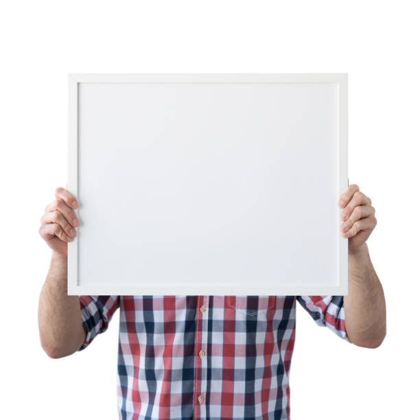 istock Holding frame mockup. Photo Mockup. The man hold frame. For frames and posters design. Frame size 20x16 (50x40cm). 1135826912