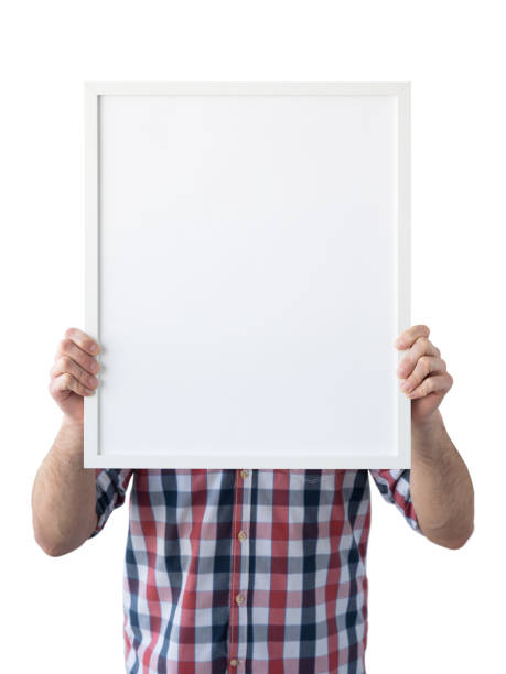 istock Holding frame mockup. Photo Mockup. The man hold frame. For frames and posters design. Frame size 16x20 (40x50cm). 1135826962
