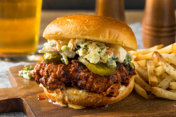 Homemade Spicy Nashville Hot Chicken Sandwich Homemade Spicy Nashville Hot Chicken Sandwich with Ranch and Pickles fried chicken stock pictures, royalty-free photos & images