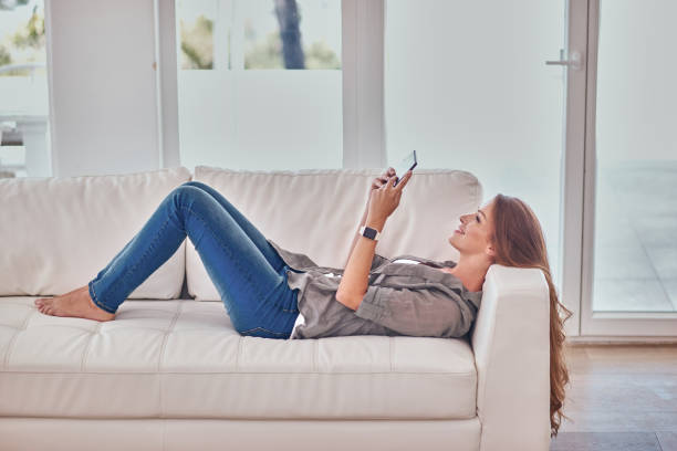 istock Young woman with digital tablet at home 1135827984