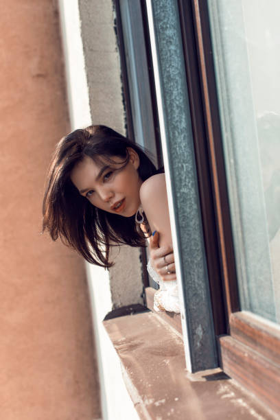 istock Cute brunette in a cozy bright apartment 1135828944