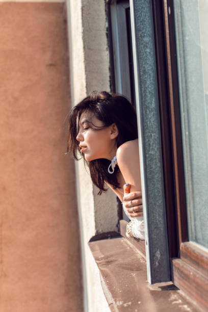 istock Cute brunette in a cozy bright apartment 1135828981