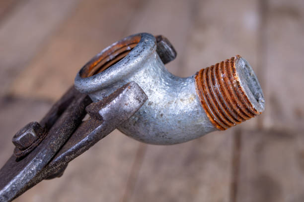 istock Hydraulic wrench and steel pipes on a workshop table. Minor mechanical work. Light background. 1135831186