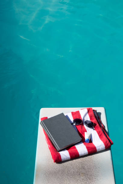 A pair of mens blue swimming shorts floating on the surface of a swimming pool