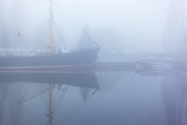 istock ship at the pier on the river in a thick dense fog 1135832351
