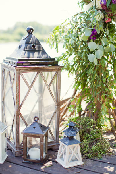 istock vintage lanterns with candles and fern 1135833818