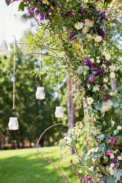 istock wedding arch with hanging burning candles 1135833875