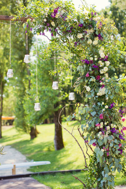 istock wedding arch with hanging burning candles 1135833887