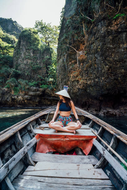 istock Young woman on a longtail boat in Thailand, Phi Phi Island 1135834016