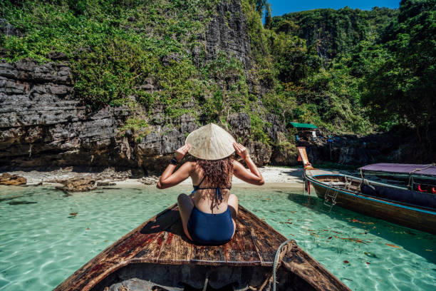 istock Young woman on a longtail boat in Thailand, Phi Phi Island 1135834020