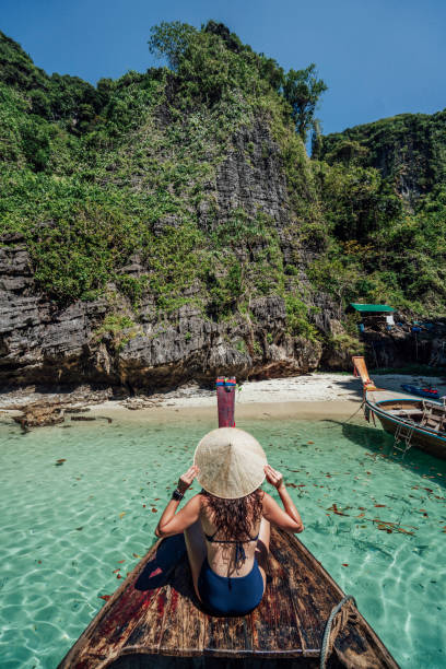 istock Young woman on a longtail boat in Thailand, Phi Phi Island 1135834022