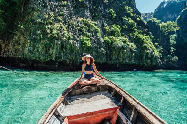 istock Young woman on a longtail boat in Thailand, Phi Phi Island 1135834030
