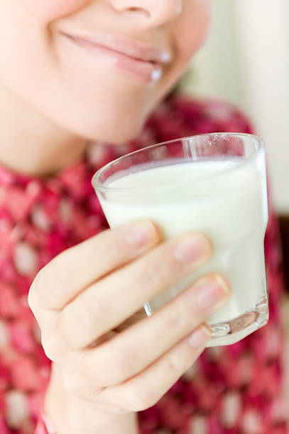 istock young woman drinking milk 113583477