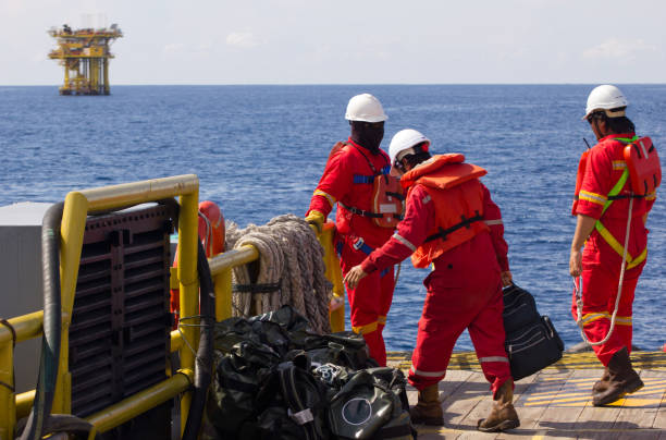 Roughnecks transported to an offshore platform stock photo