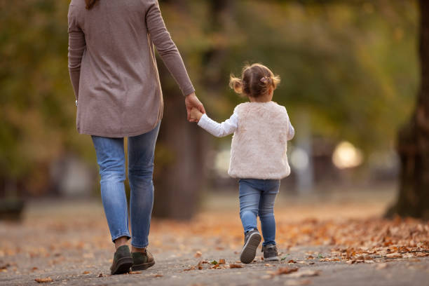 istock Mother and Daughter in the park 1135835180