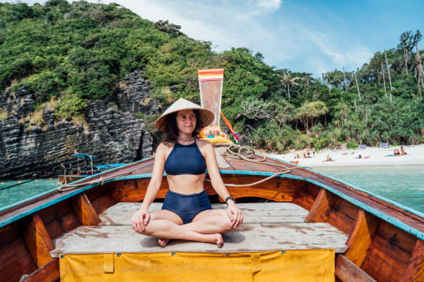 istock Young woman on a longtail boat in Thailand, Phi Phi Island 1135835380