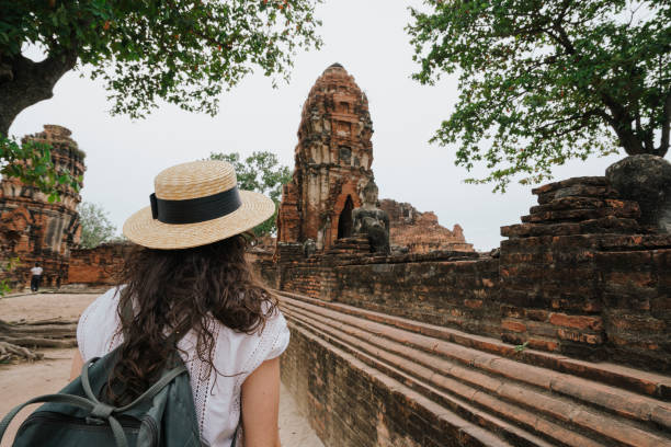 istock Young woman exploring a temple in Ayutthaya, Thailand 1135835449
