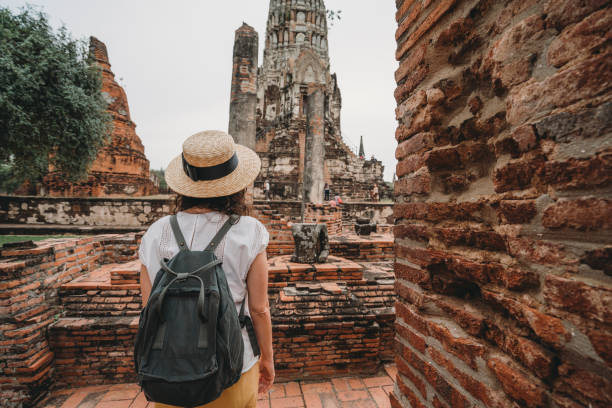 istock Young woman exploring a temple in Ayutthaya, Thailand 1135835452