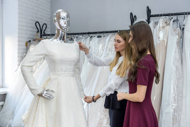 istock Young bride choosing dress for wedding ceremony 1135835571