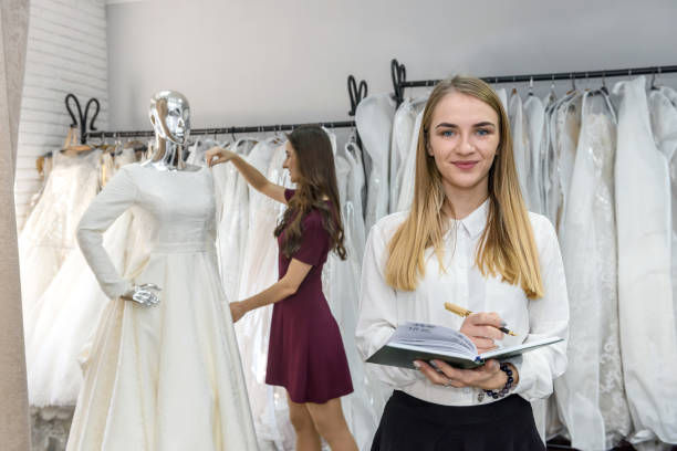 istock Young designers working at wedding dress in salon 1135836259