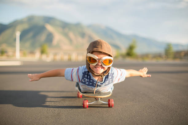 istock Young Boy Flying on Skateboard 1135837987