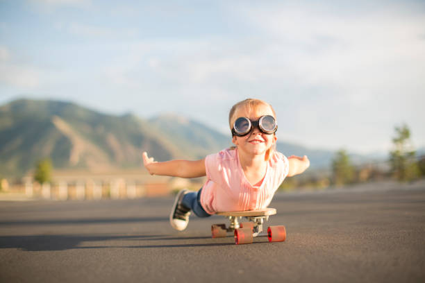 istock Young Girl Flying on Skateboard 1135837999