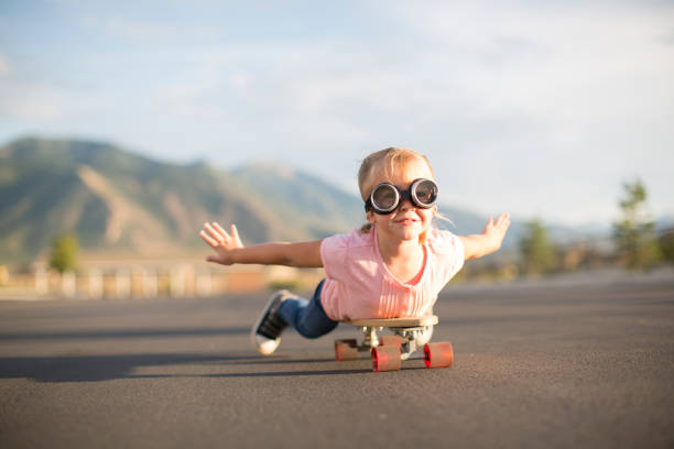 istock Young Girl Flying on Skateboard 1135838029