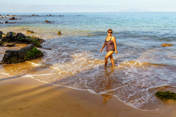 istock Senior Hispanic woman on Maui beach 1135838258