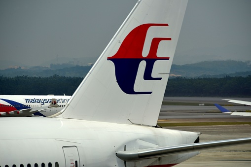 Kuala Lumpur, Malaysia: two Malaysia Airlines jets taxiing at Kuala Lumpur International Airport (KLIA) - forest and hills in the background, Sepang, Selangor