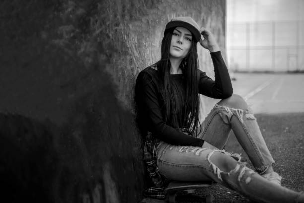 istock Beautiful woman resting on a skateboard 1135840325
