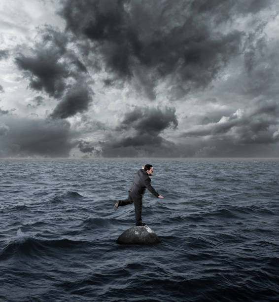istock Businessman Balancing on sea 1135840586