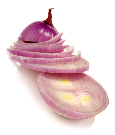 Red onions, coriander, mixed peppercorns, garlic bulbs and cloves on white background