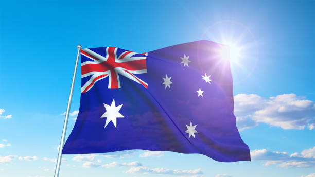 istock flag of Australia with fabric structure against a cloudy sky 1135844108