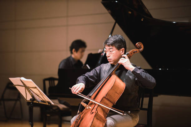 istock Cellist and pianist playing in classical music concert 1135845336