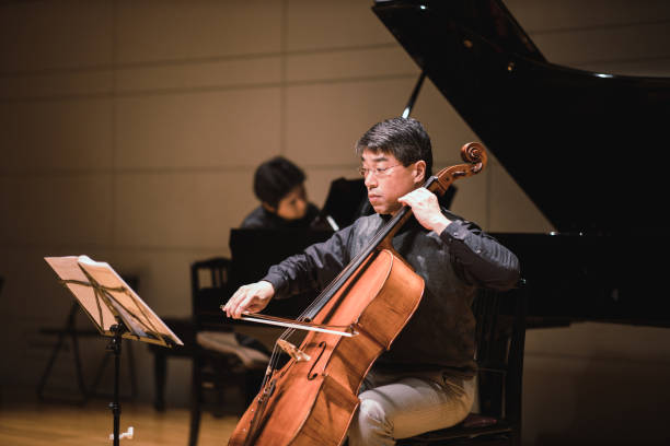 istock Cellist and pianist playing in classical music concert 1135845348
