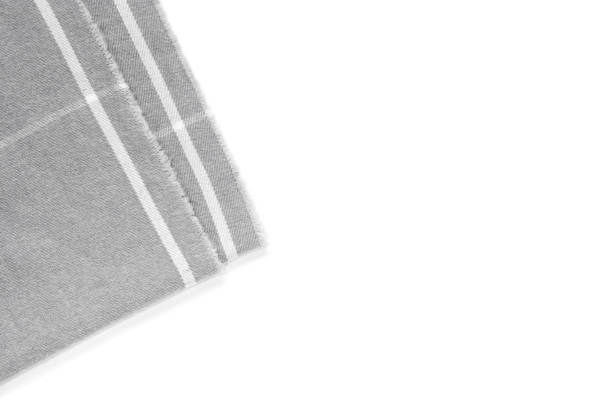 istock A piece of gray checked fabric is isolated on a white background with an area for text. 1135846325