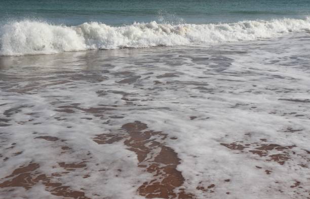 istock Waves in sea with white foam 1135846376