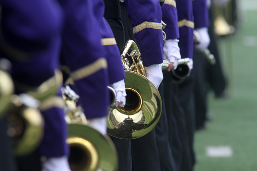 Marching band musicians performing.