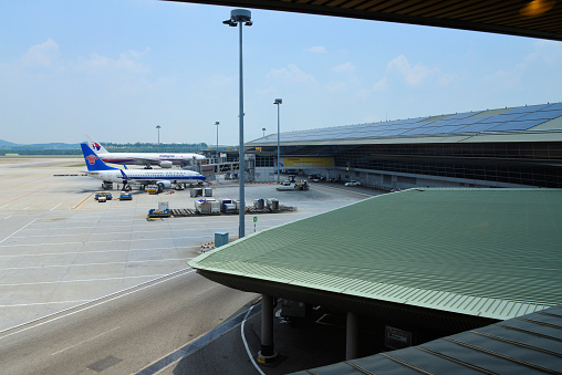 Kuala Lumpur, Malaysia: Kuala Lumpur International Airport (KLIA), Satellite terminal A - Malaysia Airlines Boeing 777-2H6(ER) and China Southern Airlines Boeing 737-71B - Sepang, Selangor