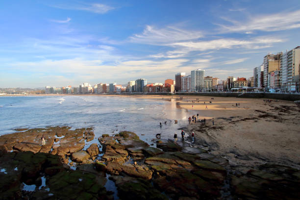 istock Main view of San Lorenzo beach with Gijon downtown on background during a sunny Easter evening, Asturias, Spain 1135853888