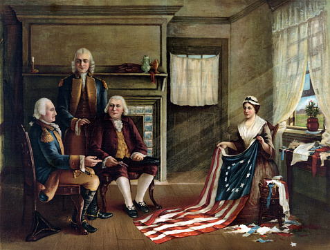Interior scene depicting Betsy Ross presenting the American flag. General George Washington is seated on the left with financier Robert Morris, and standing, delegate George Ross (uncle of Betsy's husband.)