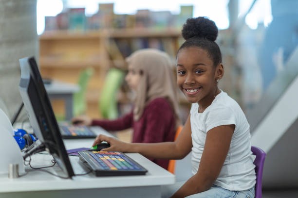 istock Smiling computer girl portrait 1135855290