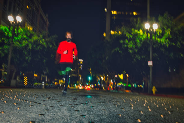 istock Man Running at Night in Los Angeles 1135862158