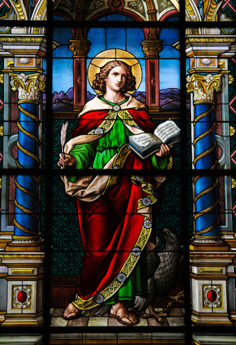 Saint John the Evangelist. Stained glass window in the German Church in Gamla Stan, Stockholm.