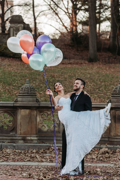 istock Grooms with Balloons in Central Park 1135868415