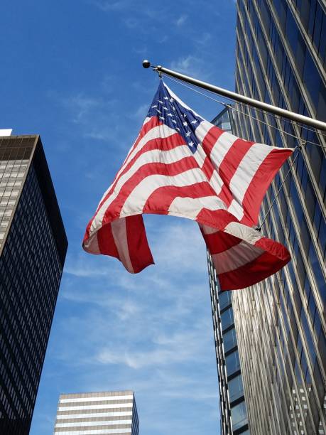 istock American flag and office buildings 1135874018